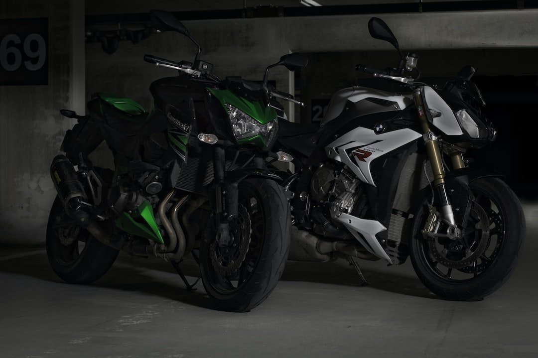 two green and white sports bike parked near wall