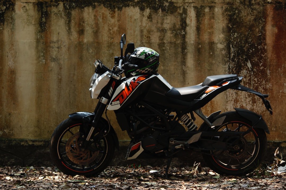 a motorcycle parked in front of a concrete wall