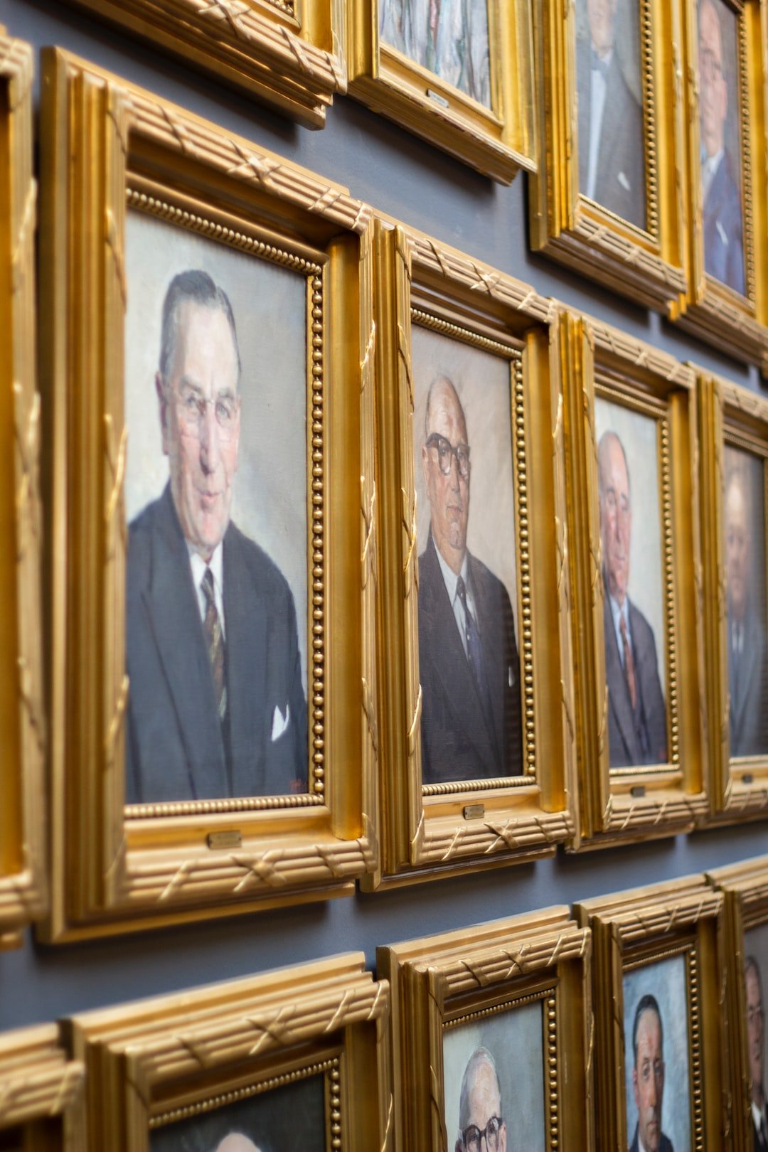 brown wooden photo frames of men