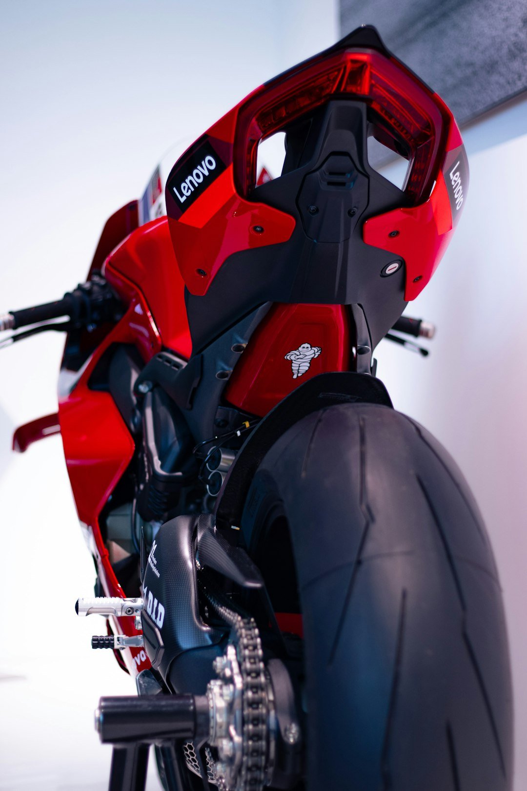 a close up of a red and black motorcycle