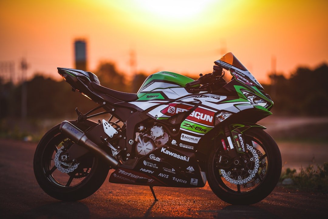black and green sports bike on road during sunset